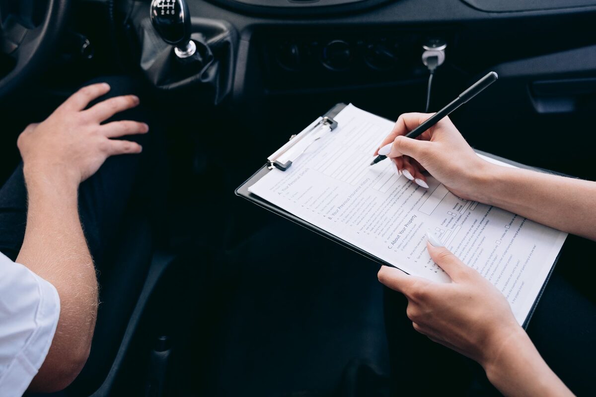 Completing a document on a clipboard inside a vehicle